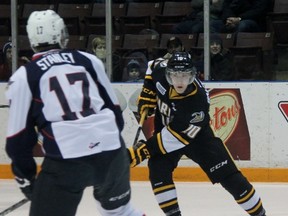 Sarnia Sting forward Anthony Salinitri enters the Windsor Spitfires zone and faces defenceman Logan Stanley during the Ontario Hockey League game o​n Saturday night at RBC Centre in Sarnia. Salinitri, a Windsor native, faced his hometown team for the fourth time in his rookie season, and the first time since being traded to the Sting. (TERRY BRIDGE/THE OBSERVER)