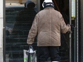 A homeless man enters the Giant Tiger in the Byward Market area Ottawa in January 2014. 
Errol McGihon/Ottawa Sun/QMI Agency