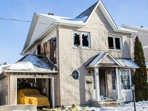 A Sunday morning fire at this home on Stonepointe Avenue in Nepean forced a family out of their home. The residents were not home at the time of the blaze. Damage estimates were not known Sunday, Jan. 25, 2015.
DANI-ELLE DUBE/Ottawa Sun/QMI Agency