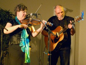 Edmonton-based band Celtara performed before a full house at the Vulcan Lodge Hall on Friday night. The band is Bonnie Gregory, who plays the fiddle, harp and sings, Andreas Illig, who plays guitar and the Irish bouzouki, Tami Cooper, who plays the flute, whistle and sings, Steven Bell, who plays the accordion, piano and sings, and Mark Arnison, who plays the bodhran (atraditional Celtic frame drum) and world percussion. Pictured here are Gregory and Illig. Simon Ducatel Vulcan Advocate