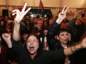 Supporters of radical leftist Syriza party celebrate in Athens January 25, 2015. Greece's anti-austerity leftist party Syriza stood on the cusp of an outright victory in Sunday's snap election, commanding a 10 point lead over Prime Minister Antonis Samaras' conservatives, an updated exit poll showed. REUTERS/Yannis Behrakis