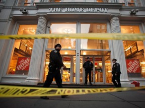 Police stand guard outside a Home Depot store following a shooting in the Manhattan borough of New York January 25, 2015. Two people were killed after a shooting in a Home Depot store in Manhattan's Chelsea neighborhood on Sunday afternoon in what appears to be a murder-suicide, two New York Police Department (NYPD) spokesmen said.  (REUTERS/Carlo Allegri)