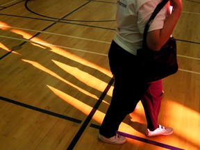 Walkers cast shadows as they pass through a patch of sunlight during the second-annual Walk for Memories at the YMCA in Trenton, Ont. Sunday, Jan. 25, 2015. The walk raised more than $14,000 for the Alzheimer Society of Belleville-Hastings-Quinte.