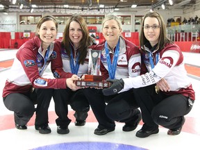Team Sweeting members (left to right): Rachelle Brown (lead), Dana Ferguson (second), Lori Olson-Johns (third) and Val Sweeting (sjip pose with the Alberta Provincial Championship after a 9-7 win in the 2015 Jiffy Lube Alberta Scotties January 25, 2015 in Lacombe, ALTA. (VINCE BURKE/ LACOMBE GLOBE/ QMI AGENCY)