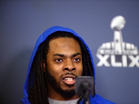 Seattle Seahawks cornerback Richard Sherman fields and answers questions during at press conference at the Arizona Grand Hotel in preparation for Super Bowl XLIX. at Arizona Grand Hotel. (Joe Camporeale-USA TODAY Sports)