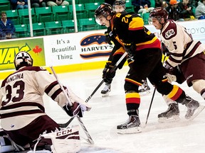 Bulls forward David Tomasek is foiled by Peterborough goalie Matthew Mancina during OHL action Sunday afternoon at Yardmen Arena. (Don Carr for The Intelligencer)