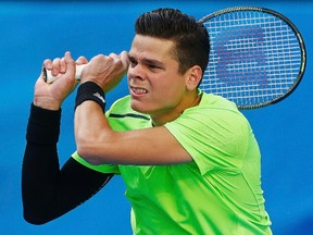 Milos Raonic of Canada reacts after hitting a return to Feliciano Lopez of Spain during their men's singles fourth round match at the Australian Open 2015 tennis tournament in Melbourne on January 26, 2015.  (REUTERS/Brandon Malone)
