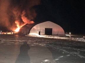 A warehouse for storing RVs, vehicles, boats and other items was heavily damaged by fire along Hwy. 148 near Luskville on Sunday night. (MRC des Collines Police submitted image)