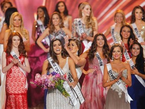 Miss Colombia, Paulina Vega is crowned by last year's Miss Universe, Venezuela's Gabriela Isler at the 63rd Annual Miss Universe Pageant in Miami, Fla., on Jan. 25, 2015. (REUTERS/Andrew Innerarity)