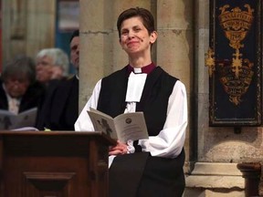 The Reverend Libby Lane reacts during a service where she was consecrated as the first female Bishop in the Church of England at York Minster in York, northern England January 26, 2015. REUTERS/Lynne Cameron/PA Wire/Pool