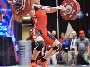 Boady Santavy, pictured here airborne lifting 140 kg, earned gold in his weight class and the best overall lifter award at the junior Canadian championships in Winnipeg on Jan. 17. Santavy, 17, has now qualified for the junior world championships and has a good shot at going to the Toronto 2015 Pan American Games. (SUBMITTED PHOTO)