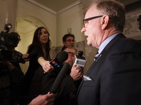 Independent MLA Joe Anglin speaks to the media after Premier Jim Prentice announced two new Progressive Conservative MLAs, Kerry Towle and Ian Donovan, who crossed the floor of the Alberta Legislature from the Wildrose Party in Edmonton, Alta., on Monday, Nov. 24, 2014. Anglin previously left the Wildrose Party. Ian Kucerak/Edmonton Sun/ QMI Agency
