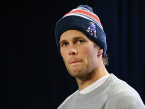 New England Patriots Quarterback Tom Brady talks to the media during a press conference to address the under inflation of footballs used in the AFC championship game at Gillette Stadium on January 22, 2015. (Maddie Meyer/Getty Images/AFP)