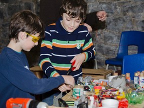 Best friends Ben Cochrane (left), 9, and Nathan Socha, 9, work on their hydro generator at the Junkyard Wars event hosted by Kingston MakerSpace: Hack Labs. By using discarded items, teams designed, scalage and build anything they can imagine. The goal is to introduce people to shared tools for artistic and technical collaboration and experimentation. The Greater Sudbury Public Library has opened a similar space at its main branch.

JULIA MCKAY//QMI AGENCY