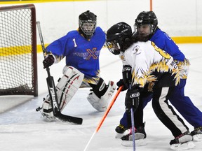 Jenna Deck of the Mitchell U12 ringette team drives the net against Forest last Thursday, Jan. 22, a 4-0 Mitchell win. Amberleigh Dearing recorded the shutout. ANDY BADER/MITCHELL ADVOCATE