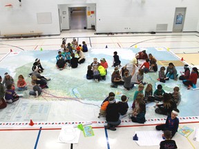 Rosedale Public School students explore Canadian geography through their recently acquired giant map of Canada. The map is on loan from Canadian Geography magazine and will remain at the school until Feb. 20. 
CARL HNATYSHYN/SARNIA THIS WEEK/QMI AGENCY