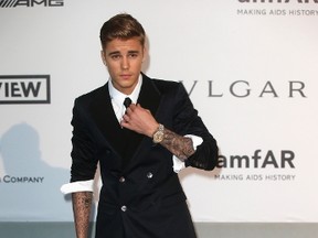 Canadian pop singer Justin Bieber arrives for amfAR's Cinema Against AIDS 2014 event in Antibes during the 67th Cannes Film Festival May 22, 2014. REUTERS/Benoit Tessier
