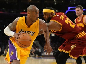 Los Angeles Lakers guard Kobe Bryant (24) drives to the basket against Cleveland Cavaliers forward LeBron James (23) in the second half of the NBA game at Staples Center. (Richard Mackson-USA TODAY Sports)