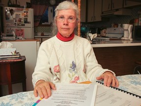 Nancy Salvador reviews her written appeal in her fight against the proposed changes to the city's bylaw regarding casinos, in her west-end Kingston home. (Julia McKay/Whig-Standard file photo)