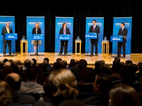 Ontario PC leadership candidates Vic Fedeli, left, Christine Elliott, Lisa MacLeod, Monte McNaughton and Patrick Brown take part in a debate at the London Convention Centre on Monday. (CRAIG GLOVER, The London Free Press)