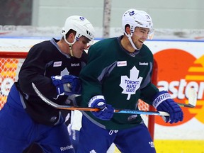 Maple Leafs defenceman Jake Gardiner gives a playful crosscheck to teammate Joffrey Lupul during the club’s workout at the MasterCard Centre on Jan. 26, 2015. (DAVE ABEL/Toronto Sun)