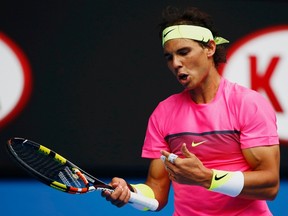 Rafael Nadal reacts after missing a shot against Tomas Berdych during their quarterfinal match at the Australian Open in Melbourne January 27, 2015. (REUTERS/Issei Kato)