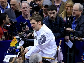 PHOENIX, AZ - JANUARY 27: Tom Brady #12 of the New England Patriots addresses the media at Super Bowl XLIX Media Day Fueled by Gatorade inside U.S. Airways Center on January 27, 2015 in Phoenix, Arizona.   Rob Carr/Getty Images/AFP== FOR NEWSPAPERS, INTERNET, TELCOS & TELEVISION USE ONLY ==