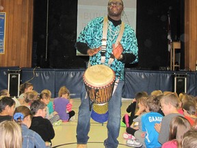 Babarinde Williams builds the beat and teamwork with his African drumming demonstration at King George VI Public School in Chatham.