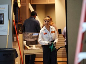 A worker looks over damage inside the Wells Fargo History Museum in San Francisco, Jan. 27, 2015. (ROBERT GALBRAITH/Reuters)