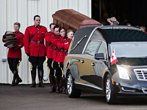 The casket containing the remains of Cst. David Wynn is brought to a waiting vehicle during the regimental funeral for slain RCMP officer Cst. David Wynn at Servus Credit Union Place in St. Albert, Alta., on Monday, Jan. 26, 2015. Codie McLachlan/QMI Agency