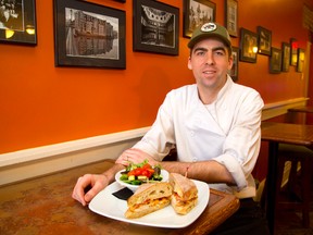 Andrew Harris of the Morrissey House with their Chicken Clubwich. (Mike Hensen, The London Free Press)