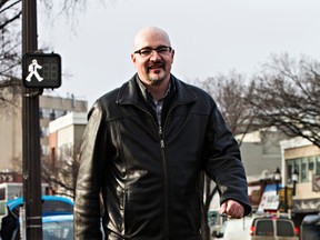 Murray Davison, Executive Director of the Old Strathcona Business Association, uses a crosswalk at Gateway Boulevard and Whyte Avenue in Edmonton, Alta., on Tuesday, Jan. 27, 2015. Davison and city police were on hand to speak in an effort to raise awareness regarding the safety of both pedestrians and drivers visiting Whyte Avenue. Codie McLachlan/Edmonton Sun