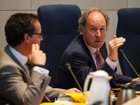 Ward 5 Coun. Michael Oshry (left) and Ward 8 Coun. Ben Henderson debate a delay on Henderson's pesticide motion during an Edmonton City Council meeting at City Hall in Edmonton, Alta., on Tuesday, Jan. 27, 2015. A pesticide motion from Coun. Ben Henderson was delayed at the meeting. Ian Kucerak/Edmonton Sun