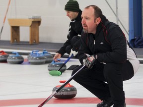 Noel Herron keeps an eye on the play during the Whig-Standard Bonspiel at the Royal Kingston Curling Club last year. Herron’s rink, which won the bonspiel, won’t be back to defend its title this year. (Whig-Standard file photo)