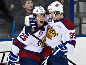 Brett Pollock, right, who leads the Oil Kings in goal scoring, celebrates a goal against the Hitmen last Saturday with teammate Lane Bauer, the only other member of the team on track to score 20 goals this season. (Codie McLachlan, Edmonton Sun)