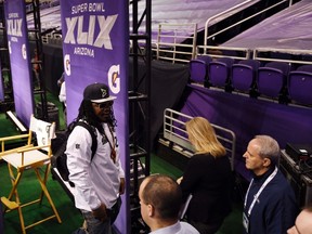 Seahawks running back Marshawn Lynch leaves his podium during media day for Super Bowl XLIX at US Airways Center in Phoenix on Tuesday, Jan. 27, 2015. (Kyle Terada/USA TODAY Sports)