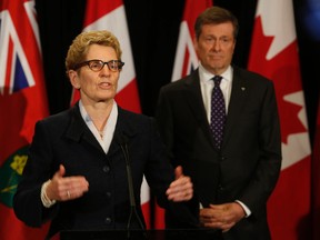 Toronto Mayor John Tory at the Ontario legislature speaking with Premier Kathleen Wynne on his first day in office, Monday December 1, 2014. (Jack Boland/Toronto Sun)