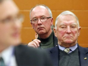 Luke Hendry/The Intelligencer 
Trenton hospital foundation chairman John Smylie, centre, and Prince Edward County hospital foundation chairman Leo Finnegan, right, listen as Quinte Health Care chief financial officer Brad Harrington speaks during a board meeting at Belleville General Hospital Tuesday. Both Smylie and Finnegan were critical of the potential for service cuts as QHC balances its budget for 2015-2016.