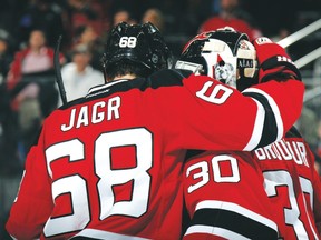Former Devils teammates Jaromir Jagr and Martin Brodeur celebrate a win during a game in 2014. (AFP file)