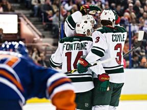 Minnesota Wild players celebrate the first goal of Tuesday's game at Rexall place. (Codie McLachlan, Edmonton Sun)