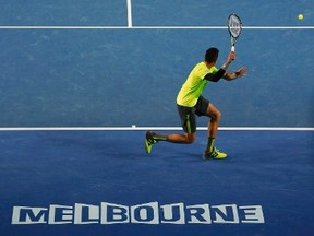 Milos Raonic of Canada prepares to hit a return against Novak Djokovic of Serbia during their men's singles quarter-final match at the Australian Open 2015 tennis tournament in Melbourne January 28, 2015. REUTERS/Brandon Malone