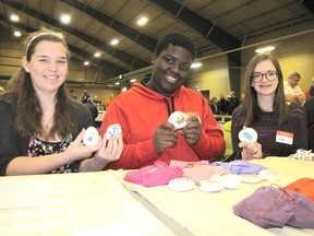 Hannah Beintema, Abeeku Paintsil and Maggie Jeffrey their Story Stones at the 2015 Chatham-Kent Toy Show and Sale at the John D. Bradley Convention Centre in Chatham.