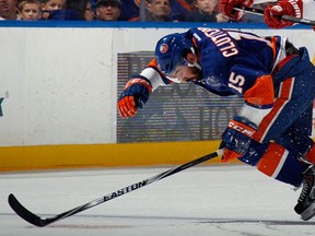 Jay Harrison hits Cal Clutterbuck of the New York Islanders in this 2014 file photo. (Bruce Bennett/Getty Images/AFP)