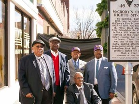 Friendship Nine members Clarence Graham, David Williamson Jr., Willie Thomas Massey, James F. Wells and Willie E. McCleod (L-R) stand in front of a historical commemorative marker outside the Five & Dine diner in Rock Hill, South Carolina, December 17, 2014.    REUTERS/Jason Miczek