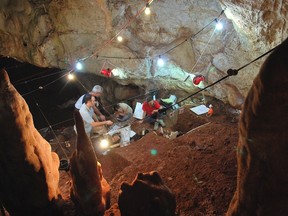 Researchers work inside Manot Cave in Israel's Western Galilee in this picture released Jan. 28, 2015. (Israel Hershkovitz, Ofer Marder & Omry Barzilai/Handout via Reuters)