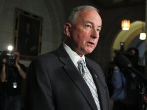 Rob Nicholson speaks to the media at Parliament Hill in this April 24, 2013 file photo. (Andre Forget/QMI Agency)