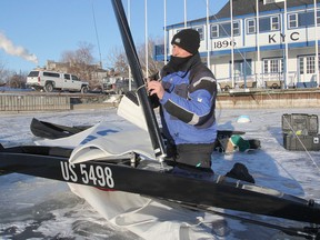Rick Gordon, one of the competitors in this week's ice yacht championships on Lake Ontario, prepares his boat for the day's sailing at the Kingston Yacht Club. (Michael Lea/The Whig-Standard)