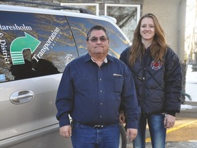 Driver Butch Boucher and EMT Shelby Turner, from the Claresholm and DistrictTransportation Society, stand by one of the vans owned by the society, which started this month taking Vulcan County clients to medical appointments. Stephen Tipper Vulcan Advocate