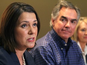 Danielle Smith, left, and Premier Jim Prentice. (Edmonton Sun)