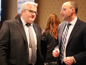 Rory Ring, of the Sarnia Lambton Chamber of Commerce, chats with London Mayor Matt Brown following the chamber's annual general meeting Wednesday. Sarnia and London officials have inked a formal agreement to explore global export opportunities together. BARBARA SIMPSON/THE OBSERVER/QMI AGENCY